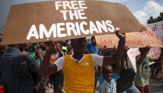 photo shows Haitians protesting kidnapping of missionaries
